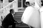 Groom putting on Bride's Shoes